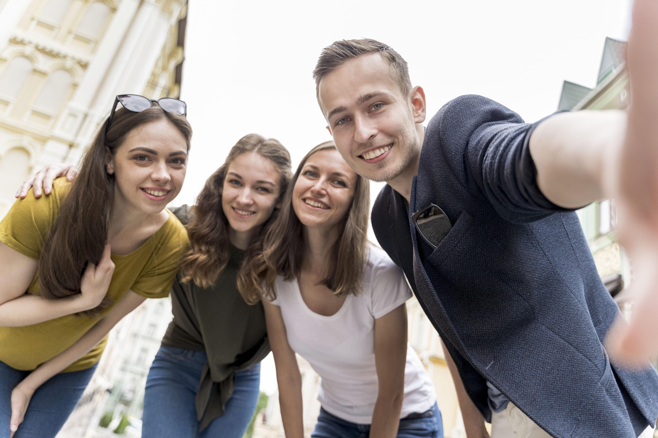 low-angle-smiley-friends-taking-selfie